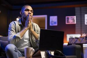 Stressed young adult fears failure and struggling with deadlines, working under pressure and stress from superiors. Frustrated worried employee making mistakes, burnout and tension. photo