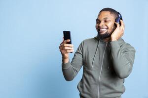 Man listening to music on smartphone photo