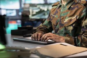 Counterintelligence agent combating organized crime and terrorism using detection system. Intelligence corps officer protecting national sovereignty by tracking terrorists entering country photo