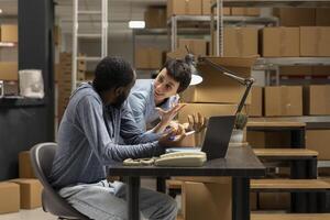 Local brand warehouse captures product handling and express delivery operations within a supply room full of goods, diverse workers managing orders and shipment logistics. Distribution. photo