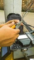 Fiber Optic Cable Splicing Technician Using Modern Fusion Splicer Tool photo