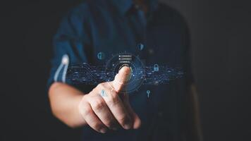 A person uses a futuristic digital interface with fingerprint scanning technology, representing cybersecurity, data authentication, and secure access. photo
