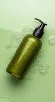 An Olive Green Liquid Soap Dispenser Surrounded by Bubbles, Olive Green Soap Dispenser with Black Pump in Liquid with Droplets and Bubbles photo
