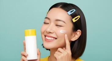 Smiling Woman Applying Sunscreen from Yellow and White Tube, Pretty Asian Woman Using Sunscreen and Smiling with Hair Accessories photo