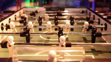 Intense foosball match with dynamic player movements video