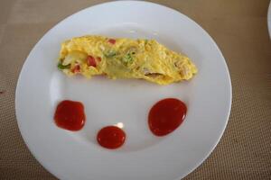 A plate with a face on it and ketchup on it photo