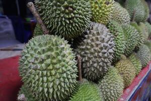 A pile of durian fruit photo