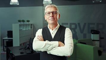 Professional Older Man in Vest Standing Inside Modern Office Space video