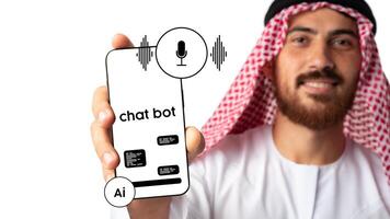 Man holding a smartphone displaying a chatbot interface with voice activation feature in a modern setting photo