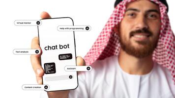 Man in traditional attire showcases mobile device featuring chatbot functionalities for various digital tasks photo