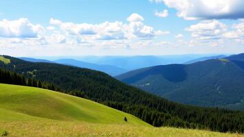 Breathtaking Landscape of Green Hills and Forested Mountains Under Blue Sky photo