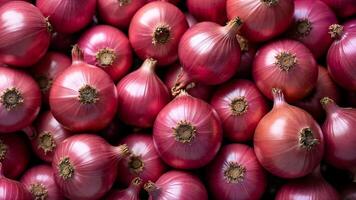 High resolution image showing a group of whole red onions closely arranged. Useful for illustrating food, agriculture, or vegetable concepts. photo