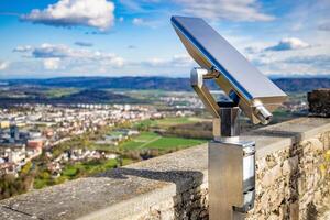 A telescope is located on the observation deck of the Hohenwil c photo