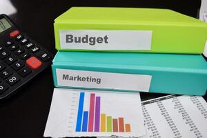 Folders with the label budget and marketing. Business management concept photo