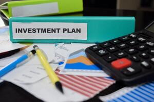 Folders with the label Investment plan. Business management concept photo