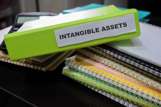 Folders with the label Intangible assets. Business management concept photo