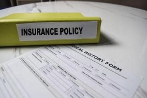Folders with the label Insurance Policy. Business management concept photo