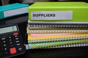 Folders with the label suppliers. Business management concept photo