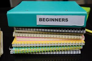 Folders with the label beginners. Business management concept photo