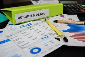 Folders with the label Business plan. Business management concept photo