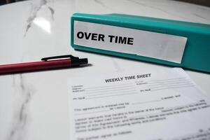 Folders with the label Over time. Business management concept photo
