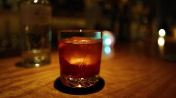 A drink on a bar counter with ambient lighting video