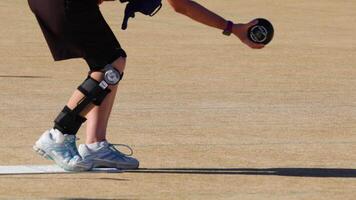 A person with knee braces rolls a lawn bowl on a sunny day at Broadbeach, Gold Coast, showcasing precision and focus video
