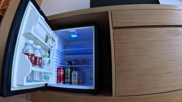 Sequence of a mini fridge door being opened and shut. video
