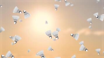 Shuttlecocks flying dynamically in a sunset backdrop video