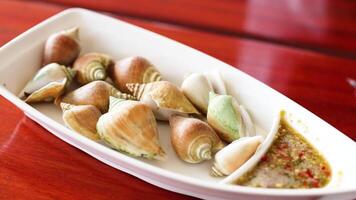 Boiled wing shell seafood with spicy sauce video