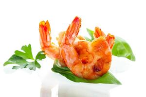 Cooking process of cooking shrimps with lemon isolated on white photo