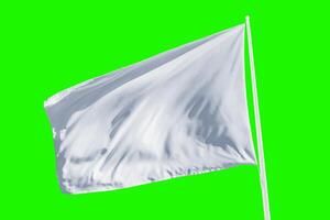 White flag waving isolated in chroma key green. Perfect for themes of surrender, calm communication, or neutral design in web or print projects photo