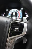 Block of control buttons for vehicle systems on the right side of the steering wheel photo