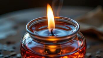 close up view of delicate flames burning atop scented oil in a glass reservoir. photo