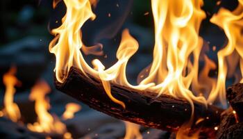 close up view of fire surging up from a columnar fire sculpture. photo