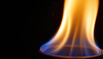 close up view of an alcohol flame nearly invisible except for faint blue outlines in the dark. photo
