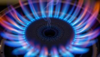 close up view of the blue core of a gas flame from a laboratory bunsen burner, with precise edges and intense heat visibly emanating from the center. photo