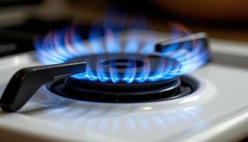 close up view of a thin blue flame burning steadily from a gas burner, its smooth and precise shape contrasting against the soft ambient shadows of a dim kitchen. photo