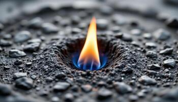close up view of isolated flame surrounded by cold, black void, highlighting its motion and glow. photo