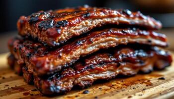 close up view of bbq baby back ribs stacked with smoke glaze and visible meat fibers. photo