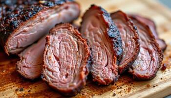 close up view of smoked brisket slices arranged on wooden board with barbecue rub crust. photo
