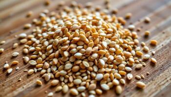 close up view of sesame seeds toasted to golden perfection, aligned neatly on a wooden cutting board. photo