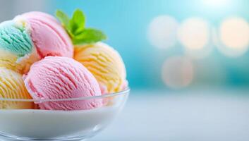 Colorful ice cream in a glass bowl. A variety of ice cream scoops are placed in a clear bowl, creating a vibrant display perfect for dessert lovers. photo