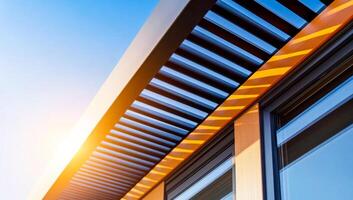Modern sunlit architecture. Sunlight casts patterns on a sleek modern roof design, highlighting the innovative structure and materials used. photo