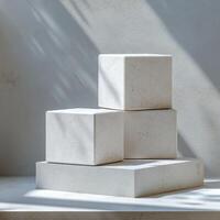 Empty podium and product pedestal in minimalistic design showcasing stone cubic podiums for display, ideal for cosmetics and other products in bright light photo
