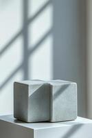 Empty podium and product pedestal featuring stone cubic podiums designed for showcasing cosmetics with minimalist style and elegant presentation enhancing modern decor photo