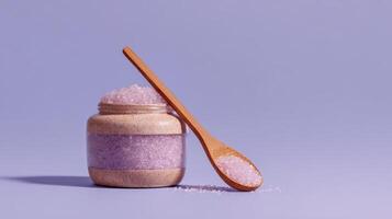 Ceramic jar filled with sugar scrub and wooden spoon ready for natural skincare routine photo