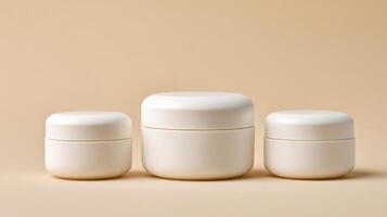 Different sizes of white moisturizer jars arranged on a soft neutral background reflecting elegance and simplicity photo