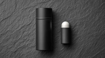 Refillable deodorant container in matte black resting on a textured dark surface photo