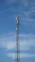 Cell phone tower with blue sky background photo